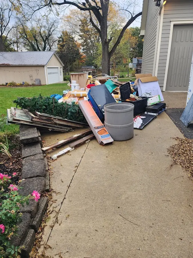 Dumpster being loaded with debris for 3 Yard Dumpster Rental in South Glens Falls